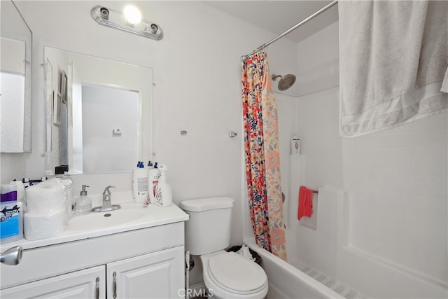 full bathroom with vanity, shower / tub combo with curtain, and toilet