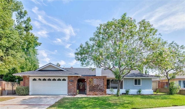 ranch-style house featuring a garage and a front lawn