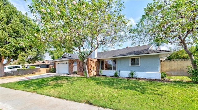 single story home featuring a garage and a front yard