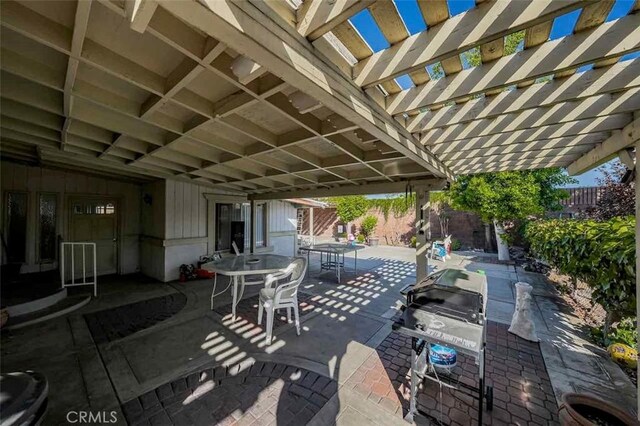 view of patio / terrace featuring a grill and a pergola