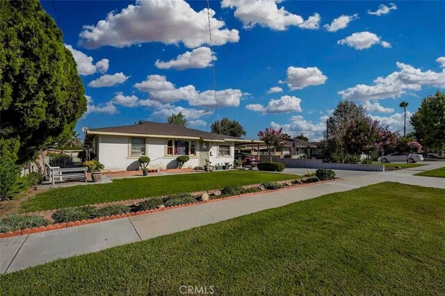 ranch-style house with a front lawn