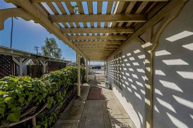 view of side of home featuring a pergola