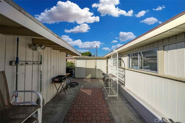 view of property exterior with a patio