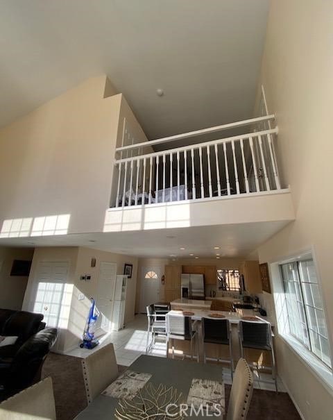 interior space with a towering ceiling and a healthy amount of sunlight