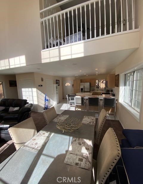 living room featuring a towering ceiling