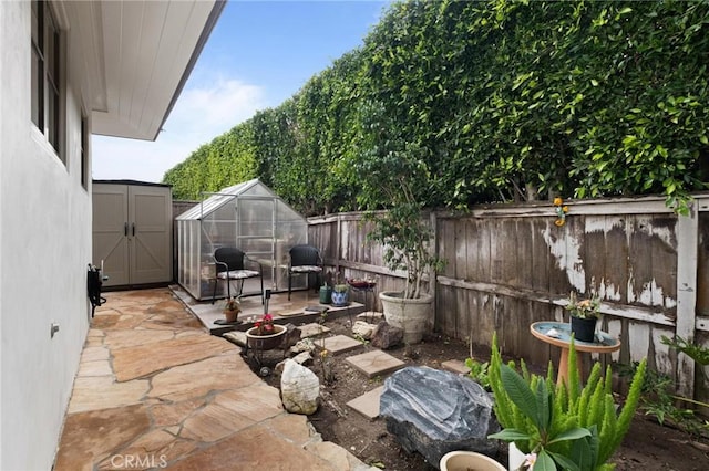 view of patio / terrace with an outbuilding