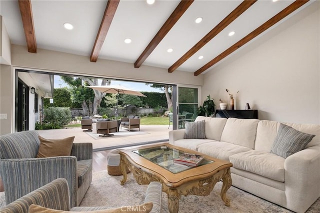 living room with lofted ceiling with beams