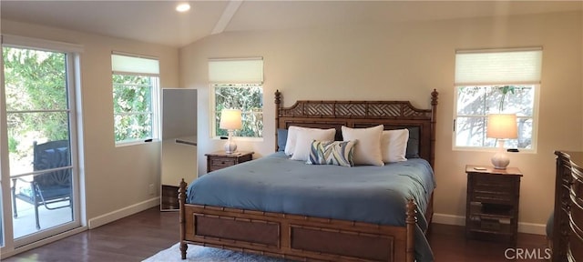 bedroom with access to exterior, dark hardwood / wood-style floors, and vaulted ceiling