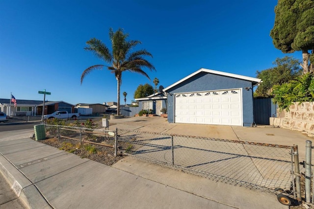 ranch-style house featuring a garage