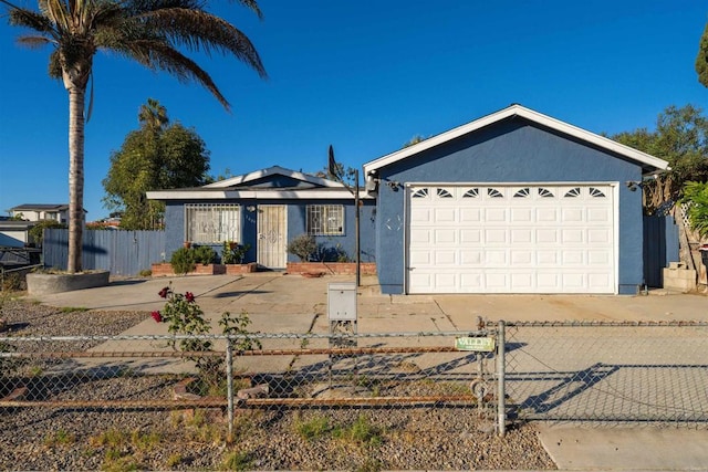 ranch-style house featuring a garage