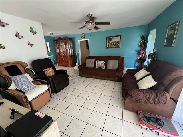 tiled living room with ceiling fan