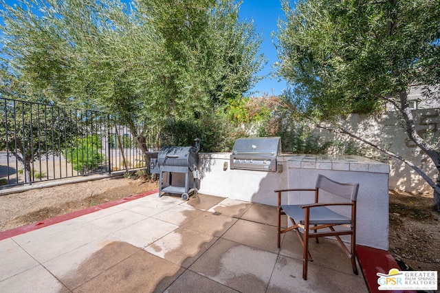 view of patio / terrace featuring area for grilling and exterior kitchen