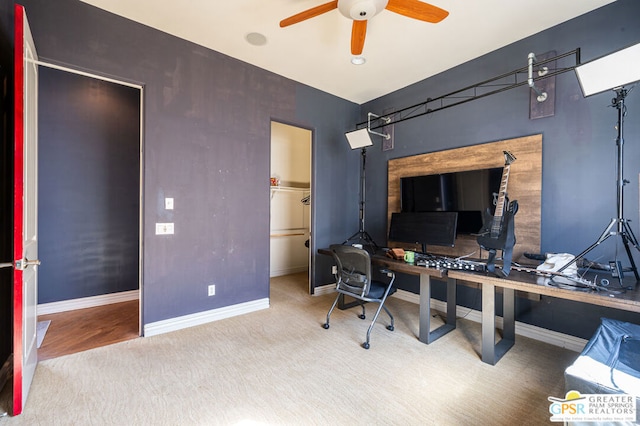 office with carpet flooring and ceiling fan