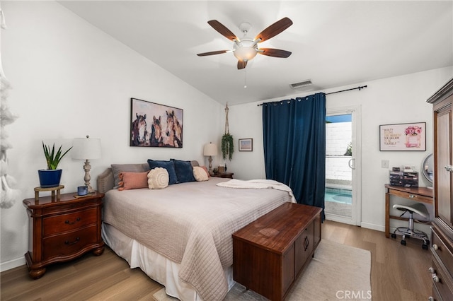 bedroom with ceiling fan, lofted ceiling, access to outside, and light wood-type flooring