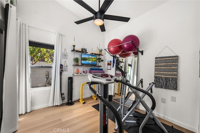 exercise room with ceiling fan and hardwood / wood-style floors