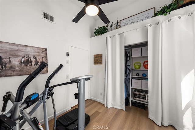 workout room with light hardwood / wood-style floors