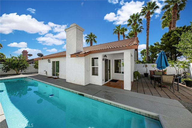 back of house with a patio