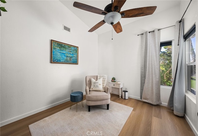 sitting room featuring vaulted ceiling, ceiling fan, and light hardwood / wood-style floors