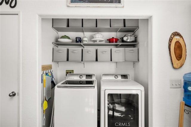 washroom featuring independent washer and dryer