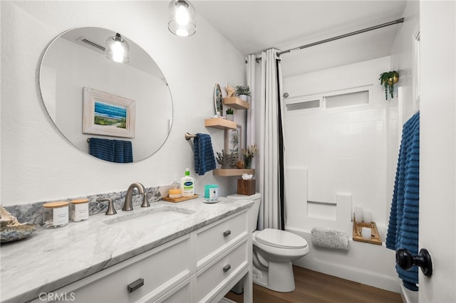 full bathroom featuring toilet, shower / tub combo, wood-type flooring, and vanity