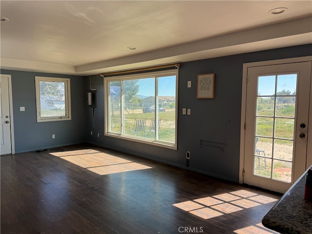 interior space with dark hardwood / wood-style floors