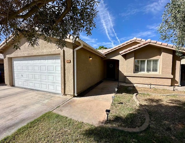 ranch-style house featuring a garage