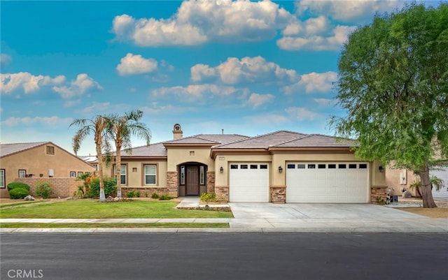 view of front facade featuring a garage and a front lawn