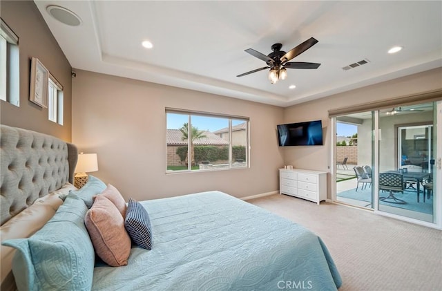 bedroom with access to exterior, light colored carpet, and ceiling fan