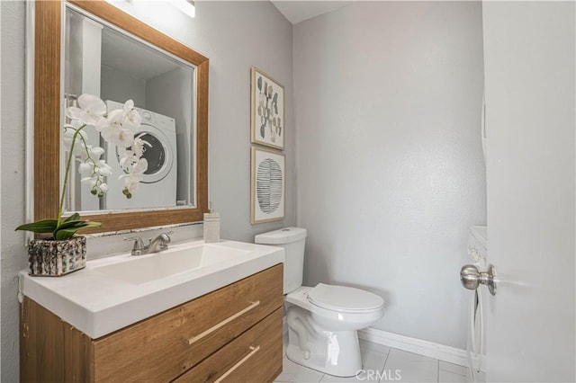 bathroom with tile patterned flooring, vanity, and toilet