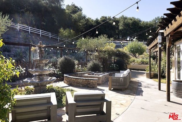 view of patio with an outdoor fire pit