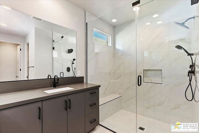 bathroom with vanity and walk in shower