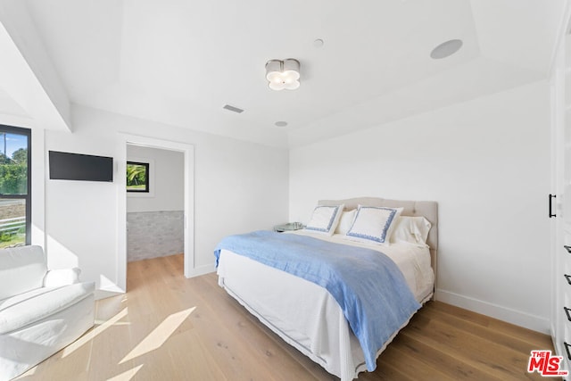 bedroom with light hardwood / wood-style flooring