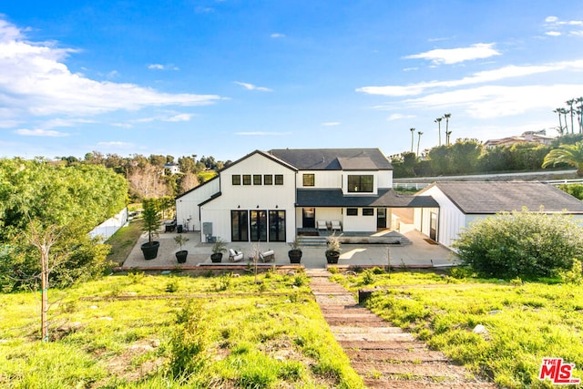 back of property featuring a patio