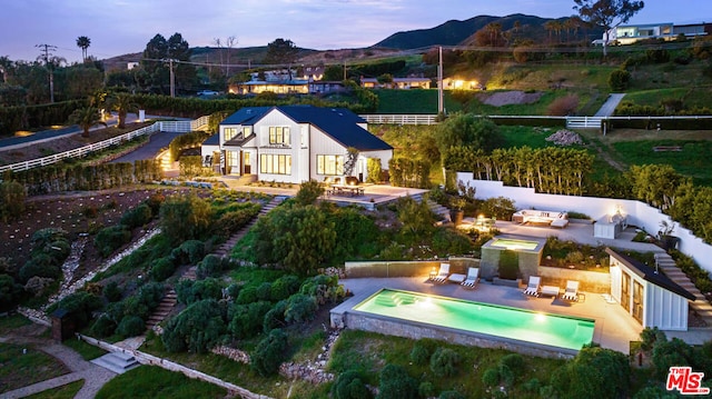 aerial view at dusk with a mountain view