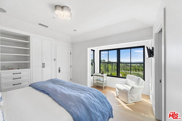 bedroom with light hardwood / wood-style floors