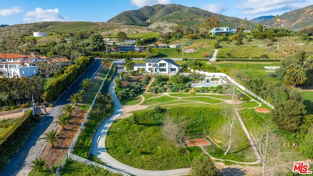 birds eye view of property featuring a mountain view