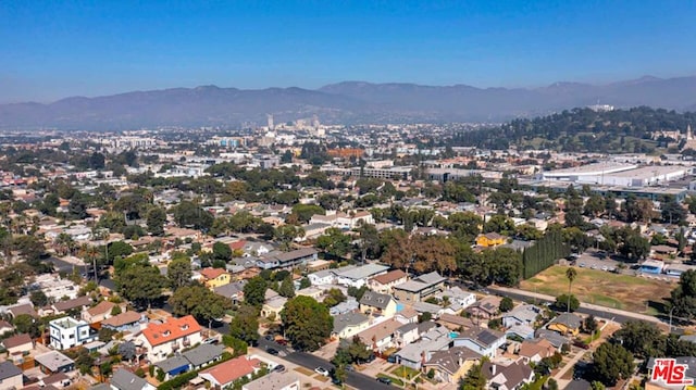 birds eye view of property with a mountain view