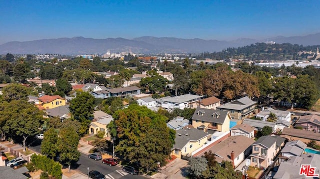 birds eye view of property with a mountain view