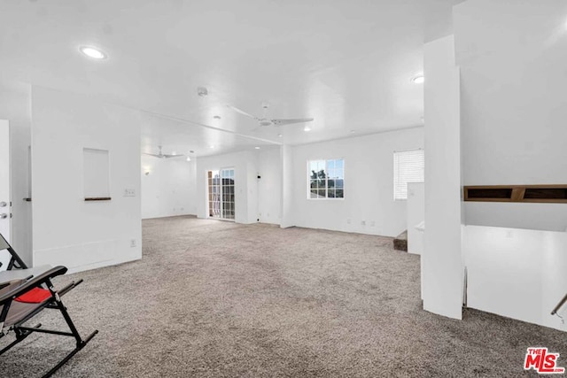 unfurnished living room with carpet floors