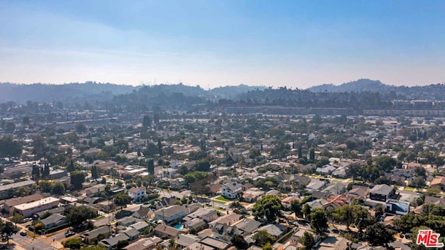 birds eye view of property with a mountain view