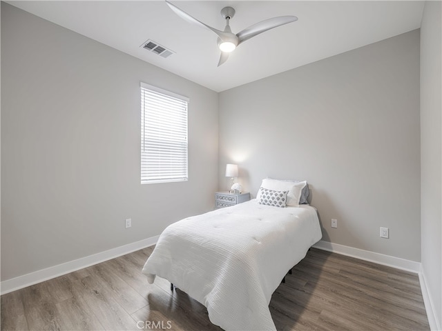 bedroom featuring hardwood / wood-style flooring and ceiling fan