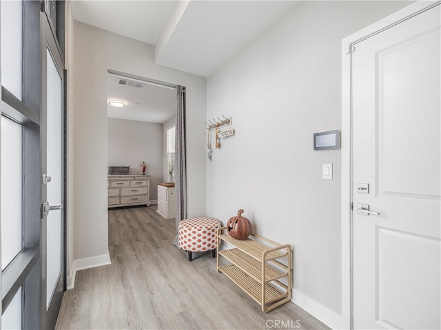 corridor featuring light hardwood / wood-style floors