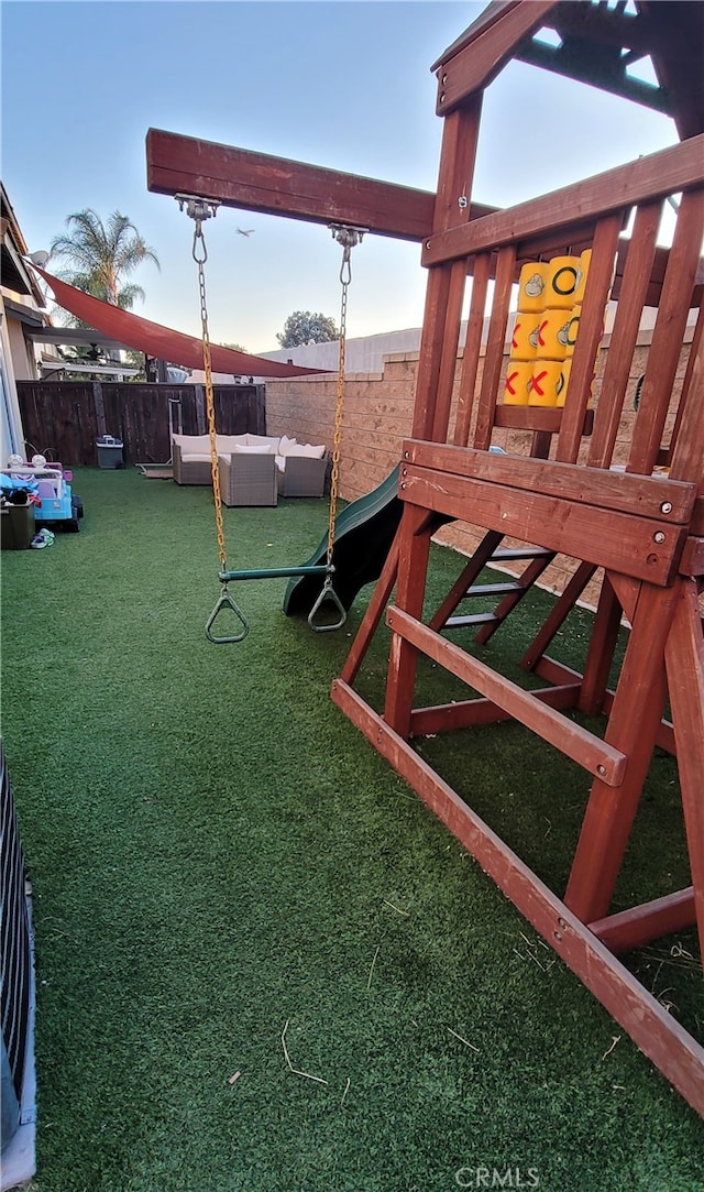 view of playground featuring a lawn