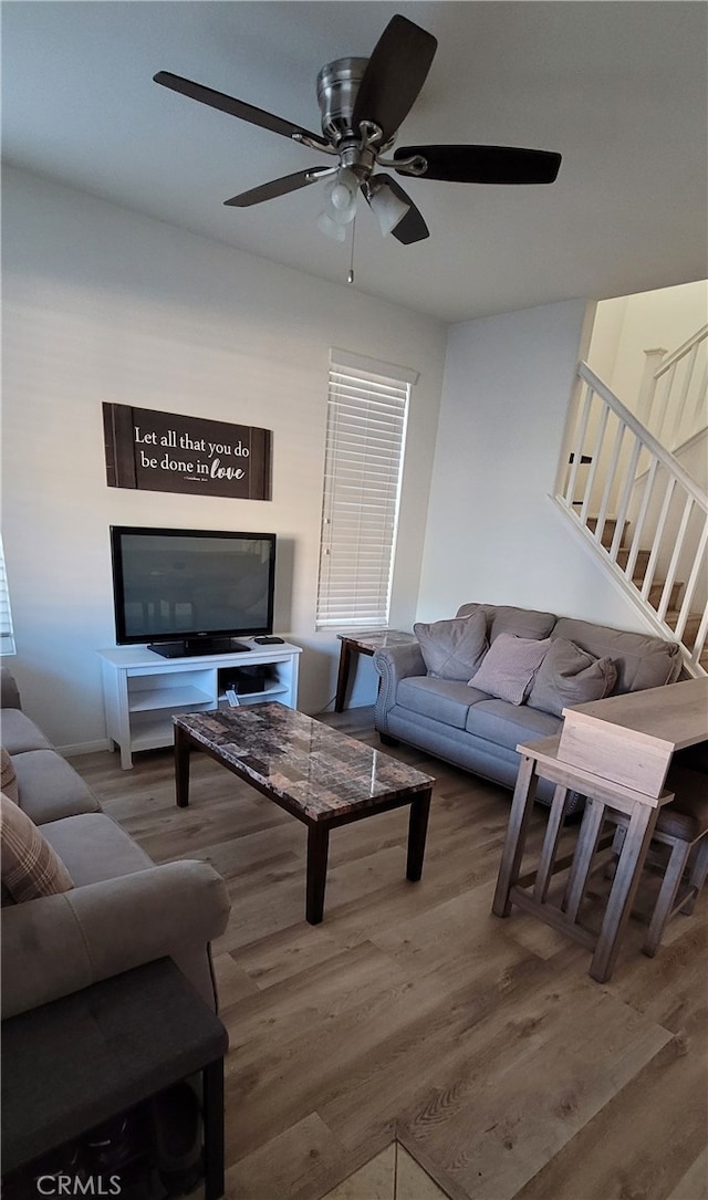 living room with ceiling fan and wood-type flooring