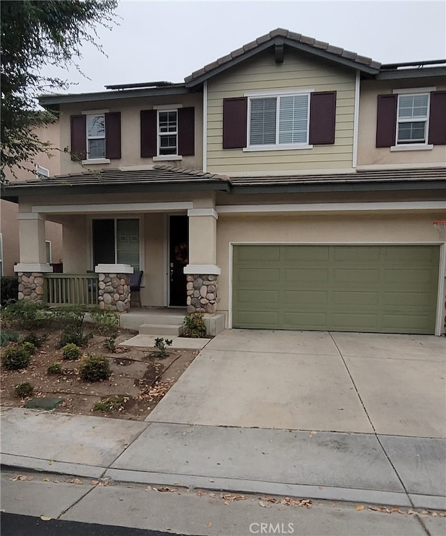 view of front of property with a garage and a porch