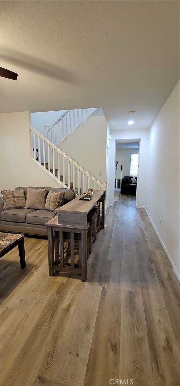 hall with hardwood / wood-style floors