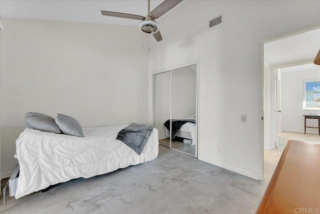 bedroom with a closet, ceiling fan, and lofted ceiling