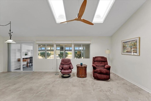 3685 Vista Campana N Unit 56, Oceanside, CA 92057 - living area featuring a skylight, vaulted ceiling, and ceiling fan