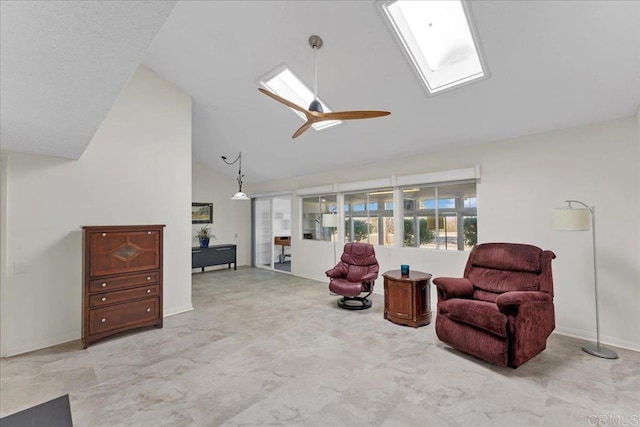 living area featuring ceiling fan and high vaulted ceiling