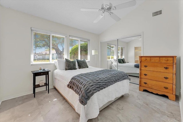 3685 Vista Campana N Unit 56, Oceanside, CA 92057 - bedroom featuring a closet, lofted ceiling, light marble finish flooring, and a ceiling fan